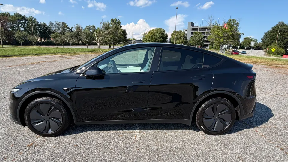 2026 Tesla Model Y in black — side profile