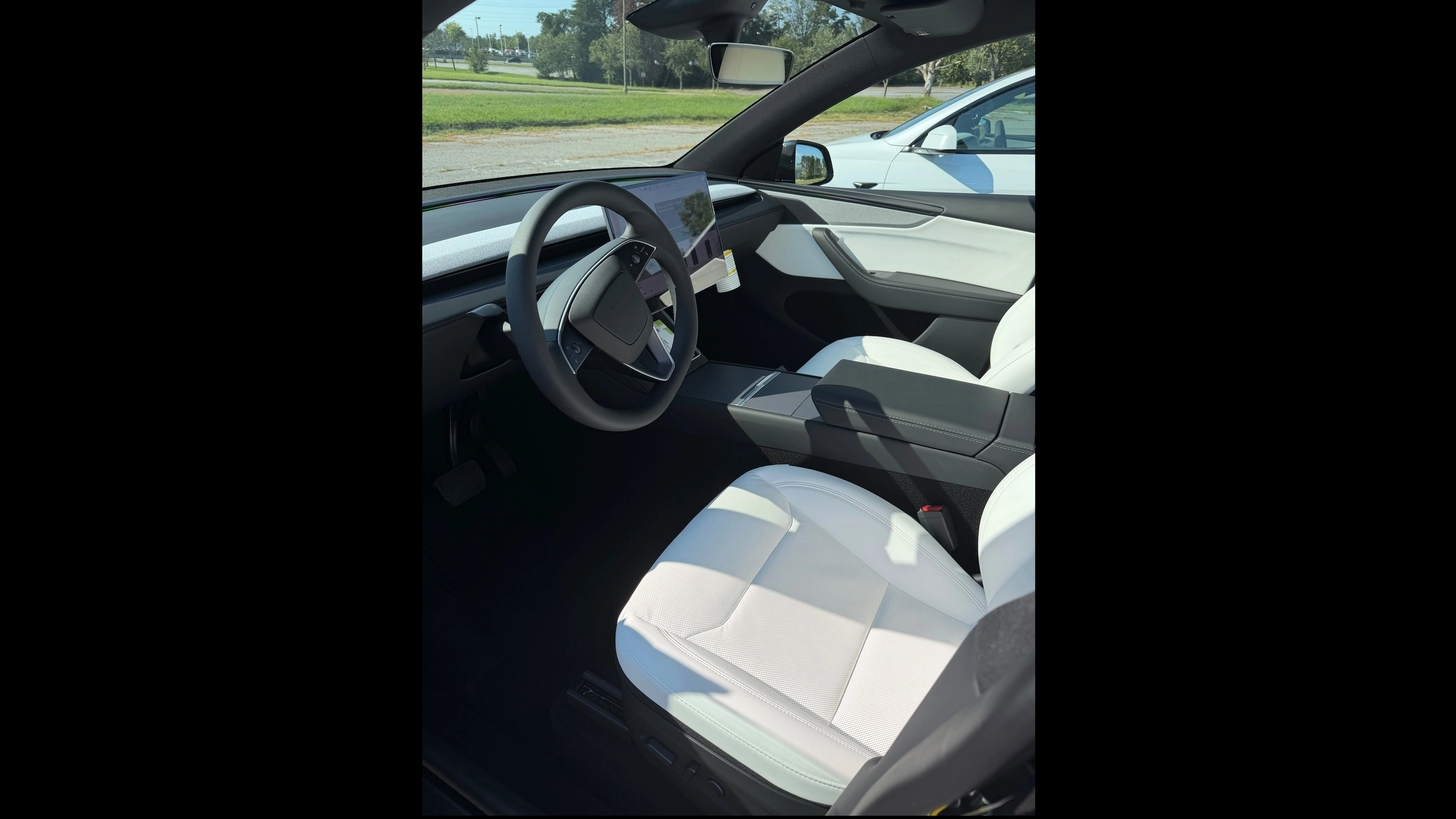 2026 Tesla Model Y interior — black and white two-tone